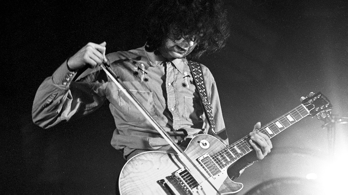 Jimmy Page of Led Zeppelin plays a Gibson Les Paul Standard guitar with a violin bow while performing on stage at Oude Rai on 27th May 1972 in Amsterdam, Netherlands