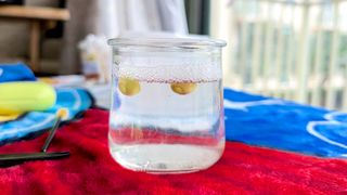 Cleaning sports earbud tips in a soapy solution