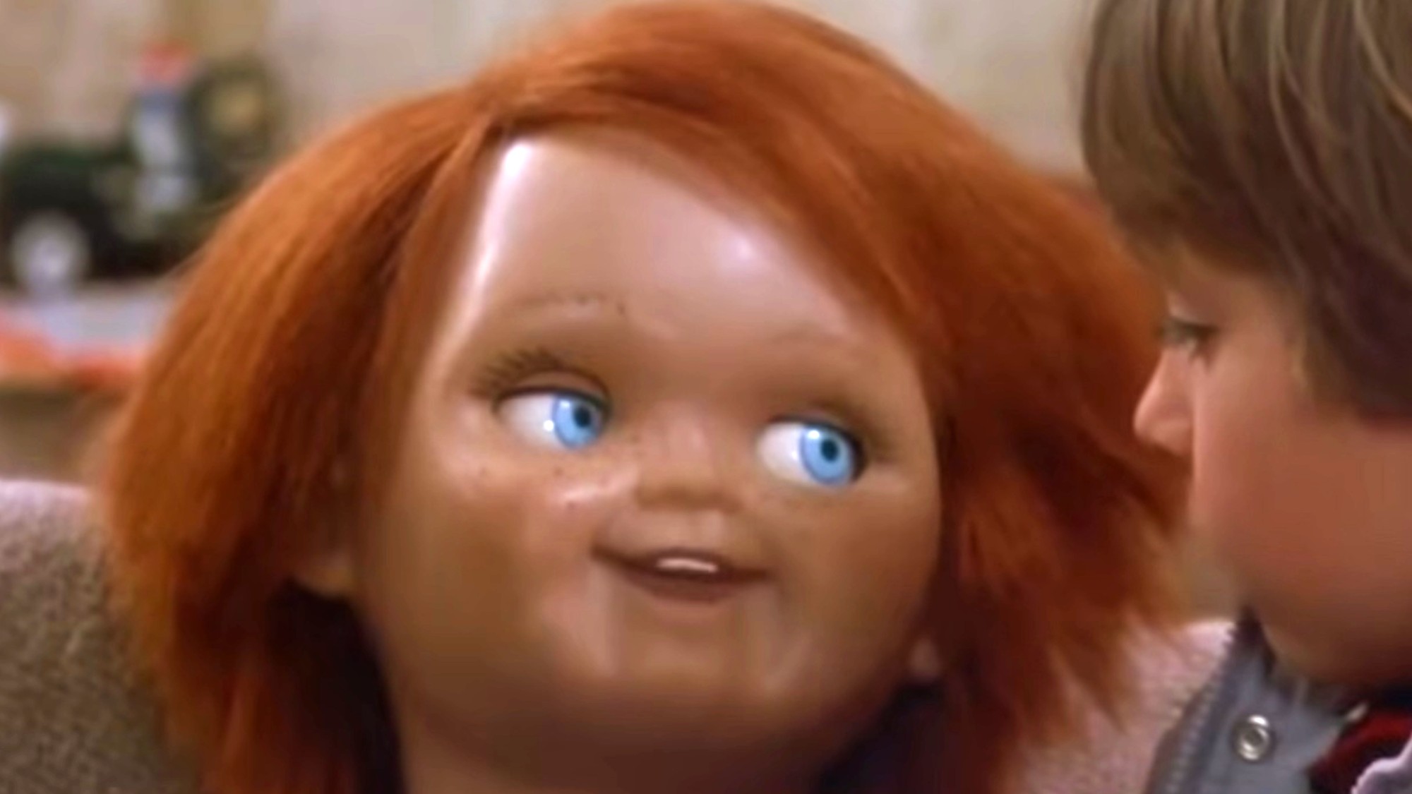 Chucky looking up and smiling in Child's Play