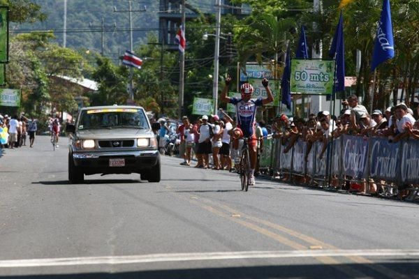 A Citibank-Economy Rent A Car-Blue rider celebrates his teammate's win