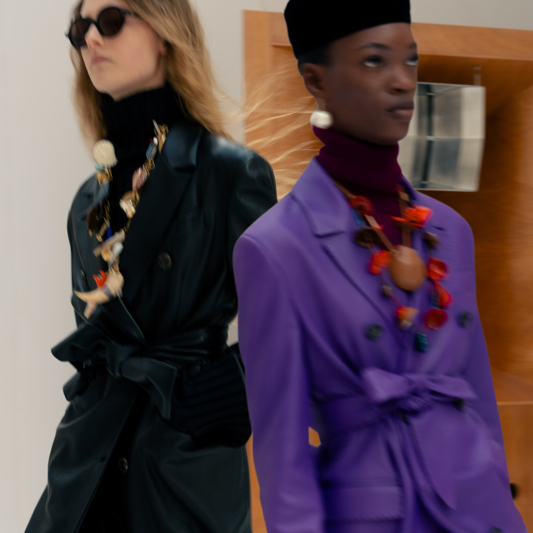 models on the celine fall 2026 runway wearing trench coats and oversize necklaces