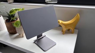 Lululook Foldable Magnetic iPad Stand on a bedside table with iPad Pro