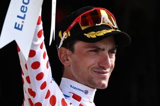 Lidl - Trek's Italian rider Giulio Ciccone celebrates on the podium with the best climber's polka dot (dotted) jersey after the 17th stage of the 110th edition of the Tour de France cycling race, 166 km between Saint-Gervais Mont-Blanc and Courchevel, in the French Alps, on July 19, 2023. (Photo by Anne-Christine POUJOULAT / AFP)