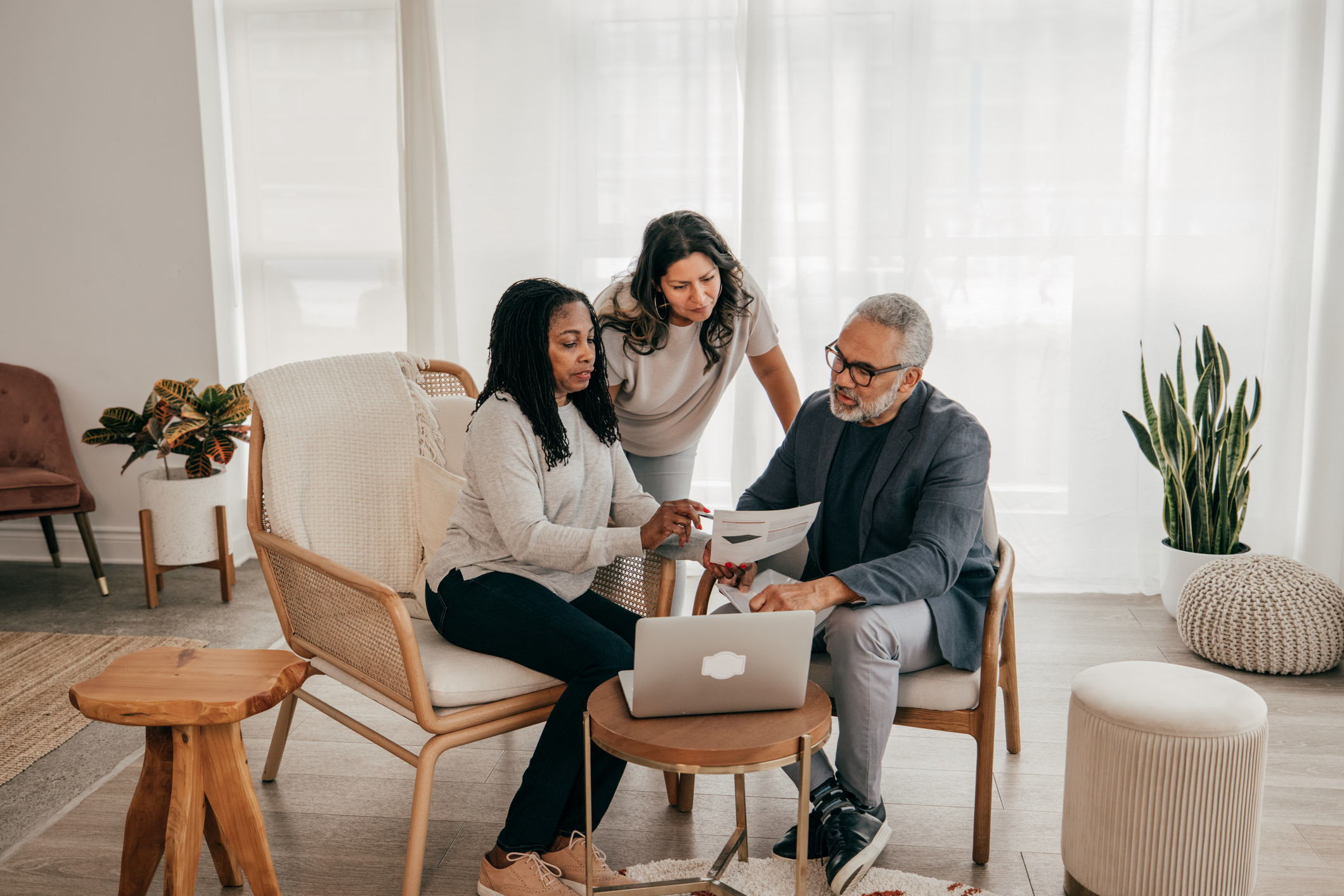 Parents and child going over documents.