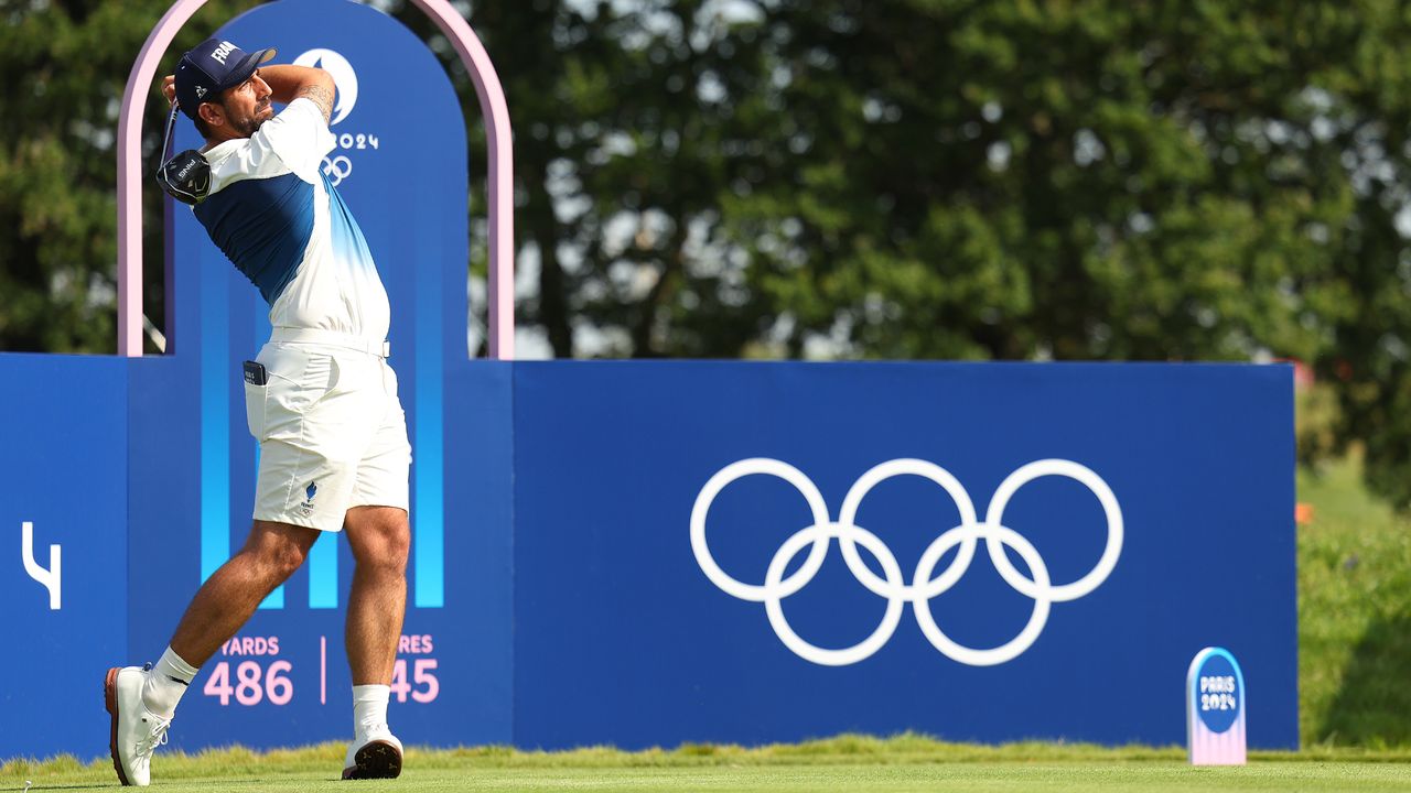 Matthieu Pavon takes a tee shot during an Olympics practice round 