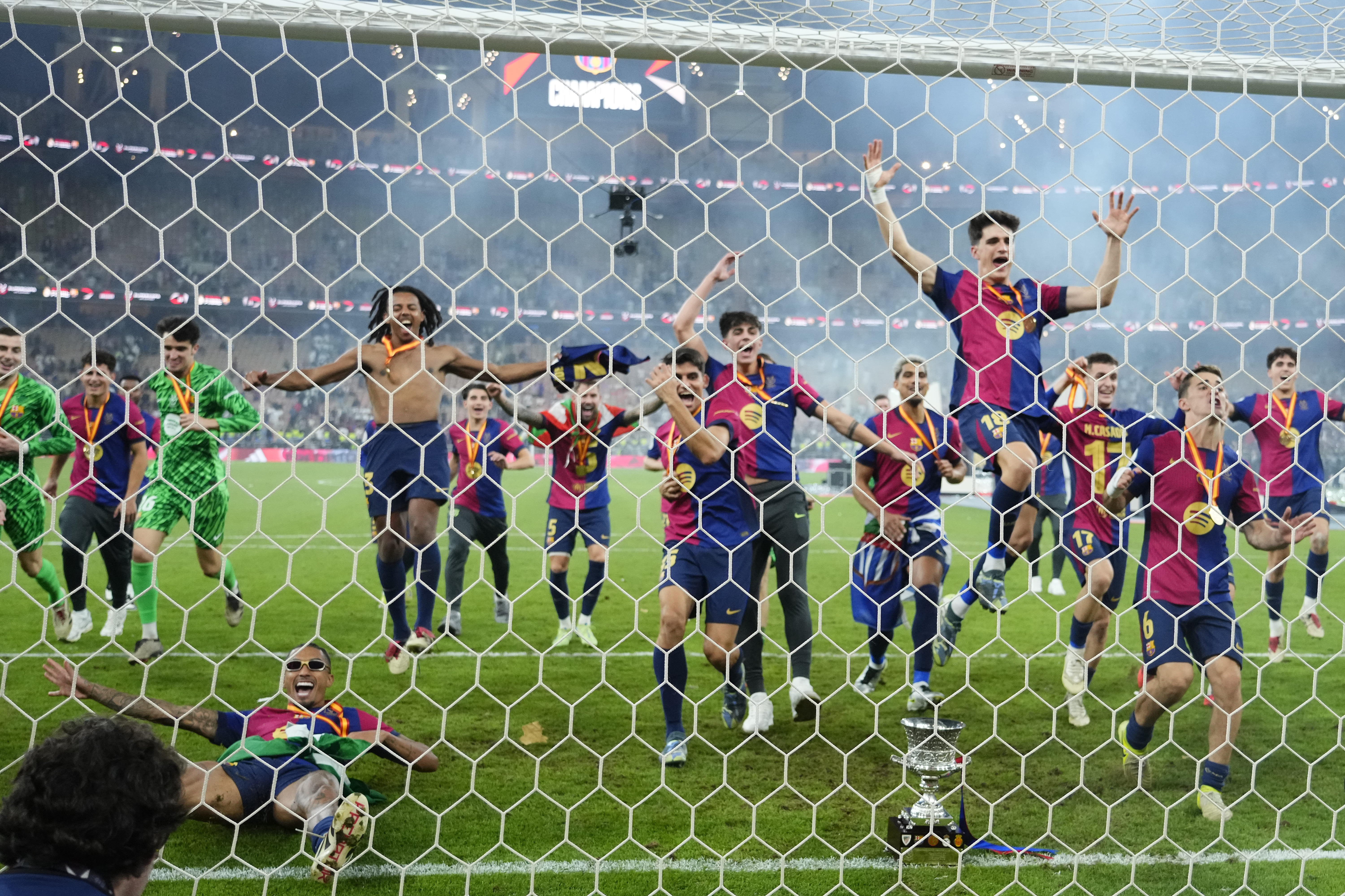 Barcelona players celebrate victory over Real Madrid in the Supercopa de España final in January 2025.