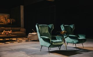 The fireplace seating of the show set features 1950s Gio Ponti chairs reupholstered in velvet by Jon Urgoiti.