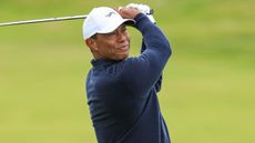 Tiger Woods takes a shot at The Open