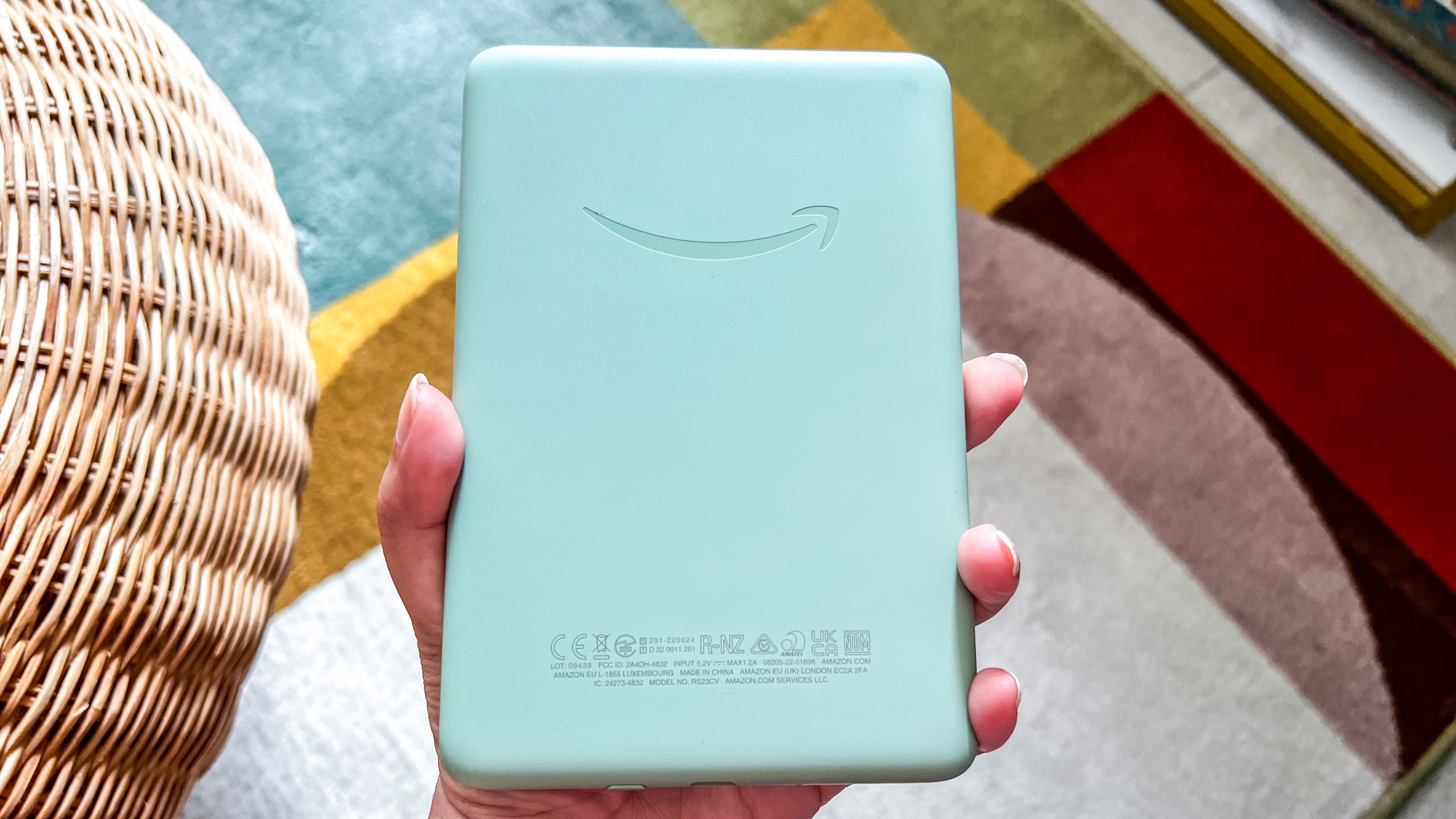 The smooth plastic rear panel of the 2024 Kindle with the Amazon logo