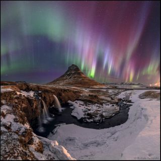 "Here the northern lights appear in all colors above an iconic landmark of Iceland, the waterfalls and mountain of Kirkjufell (Church mountain) in Snaefellsnes peninsula," Babak Tafreshi wrote in an image description of this photo on his website.