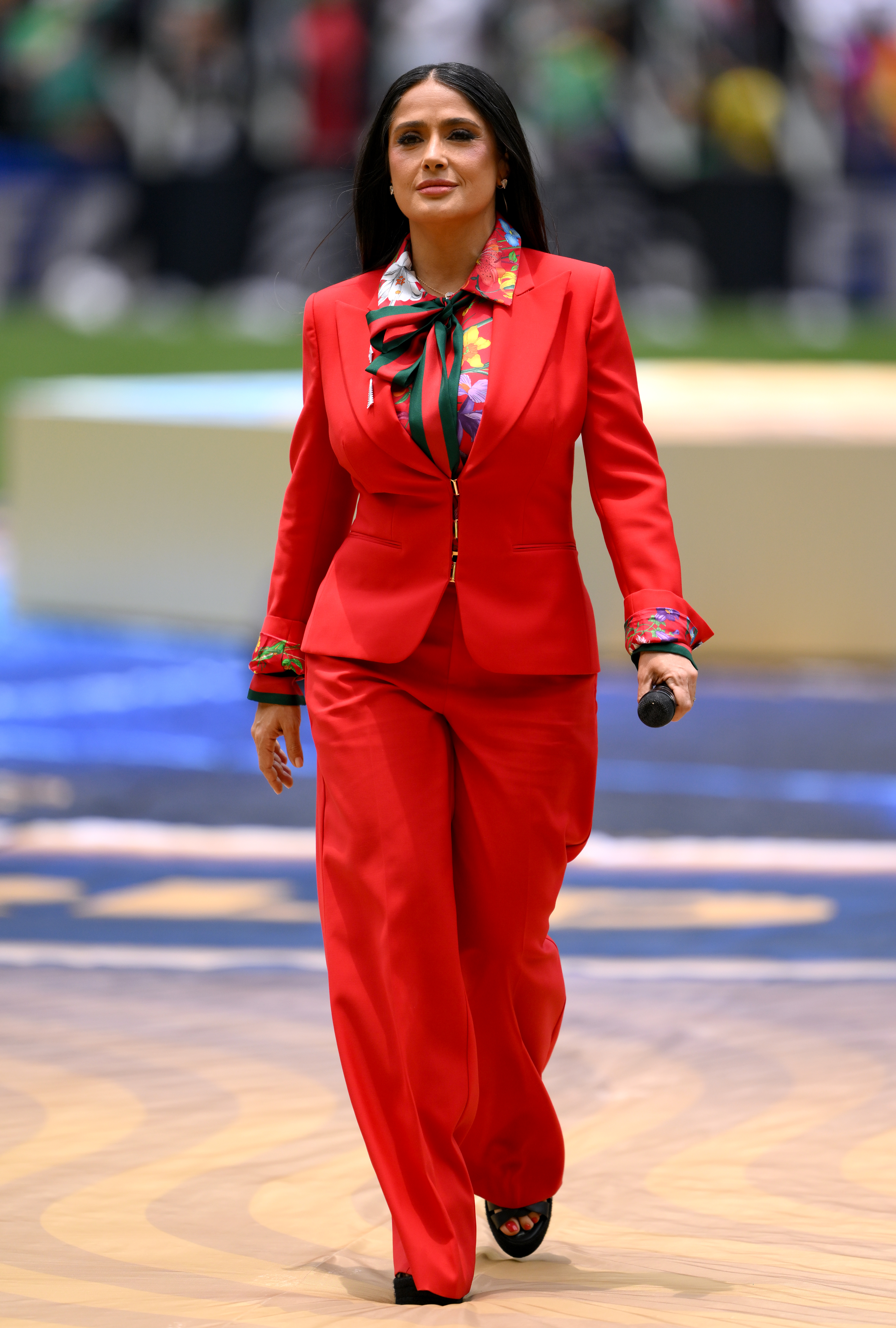 Salma Hayek opened the 2026 World Cup in a custom strawberry red suit from Gucci