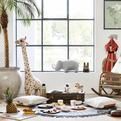 white childrens room with rocking chair and toys