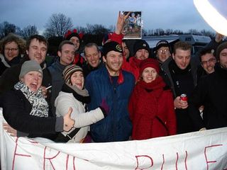 Erik Tonkin's fan club with a sign that says Eric Rules