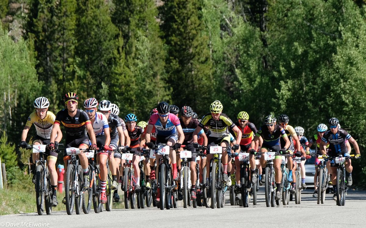The peloton about two miles from the top of the initial climb with eventual race winner Payson McElveen (Orange Seal) riding second wheel
