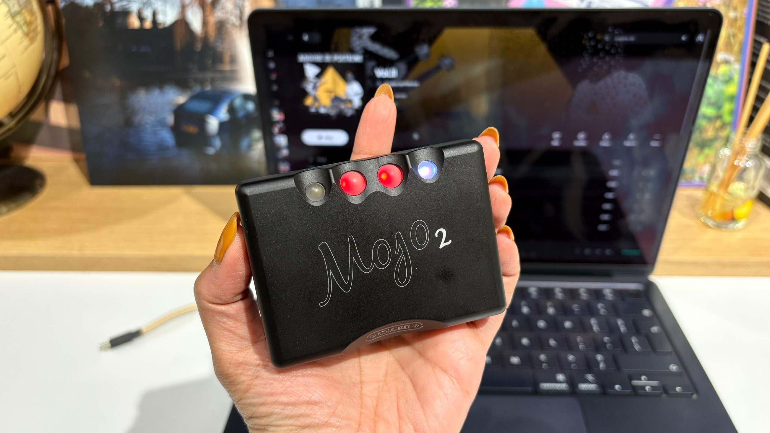 Chord Mojo 2 (2026 version) on desktop with MacBook