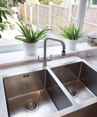 An image of a kitchen sink with a food waste disposal system