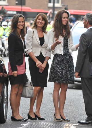 Catherine Middleton (R) is seen arriving with her mother Carole Middleton (M) and sister Pippa Middleton (L) at the Goring Hotel, where she will spend her last night as a single woman ahead of the Royal Wedding on April 28, 2011 in London, England.