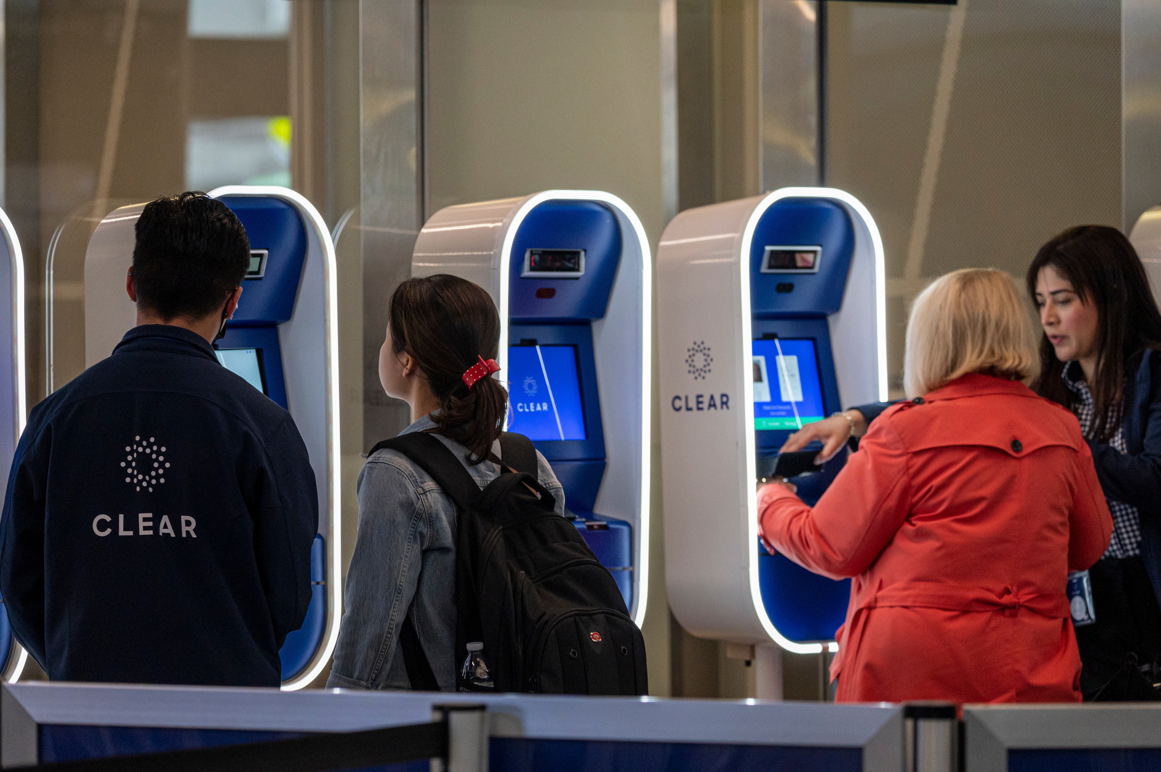 Passengers stand in Clear Plus line that gets them to their gate faster, using their eyes or fingerprints to verification