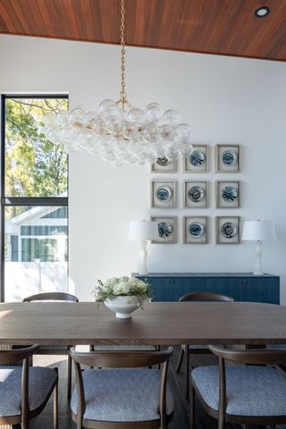 Modern dining room painted in Benjamin Moore's Simply White.