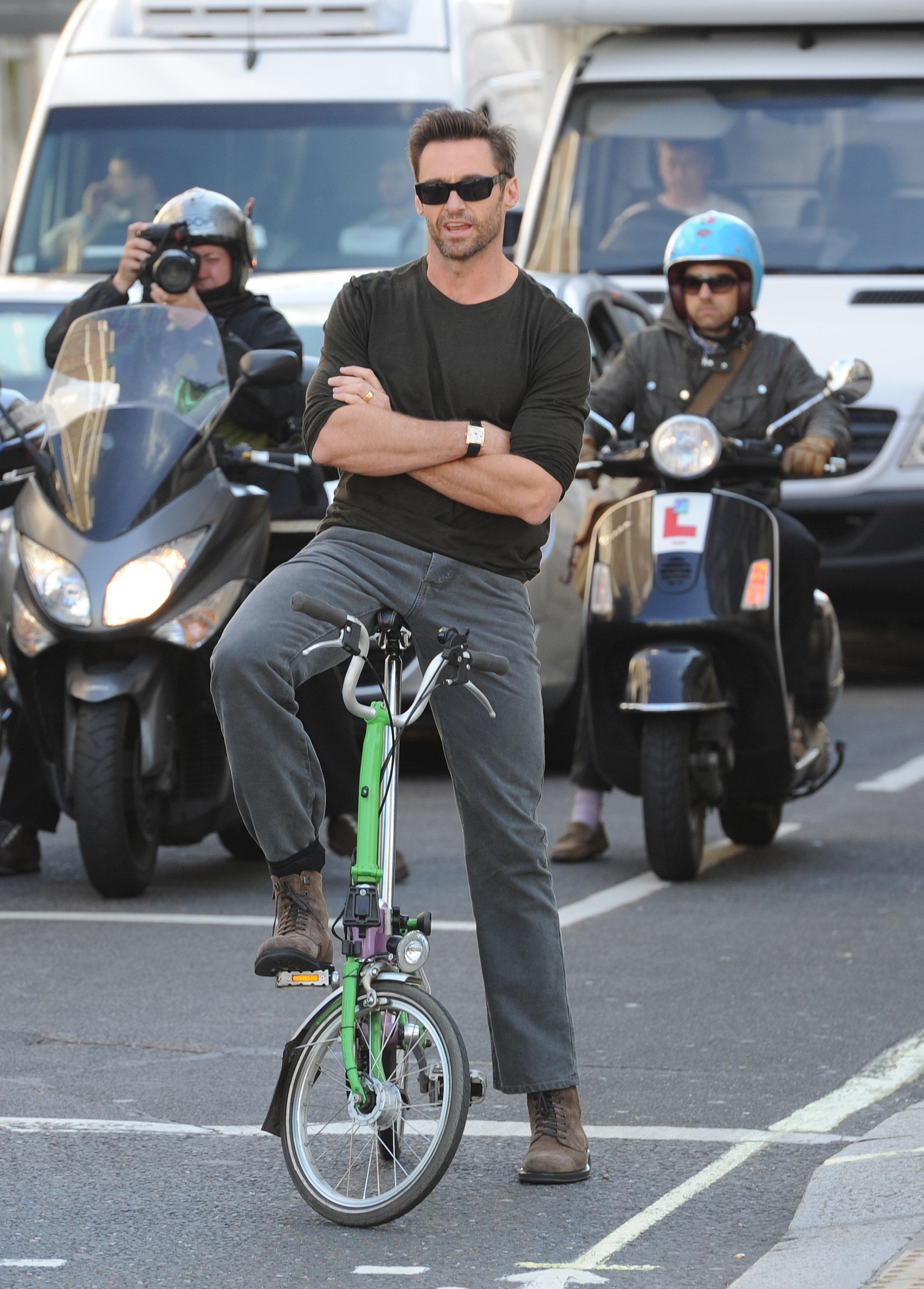 Hugh Jackman on a foldable bike