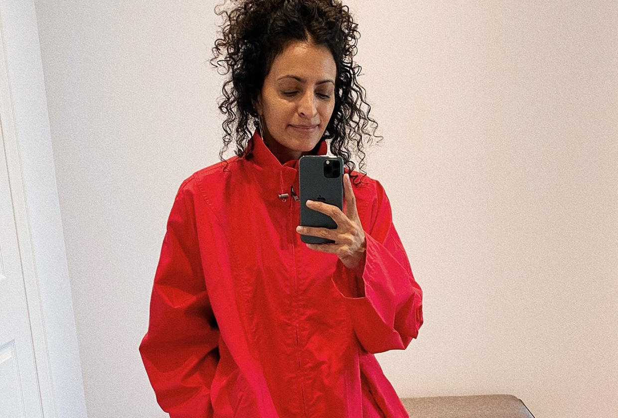 Neelam Ahooja wearing a red utility anorak from The Row.