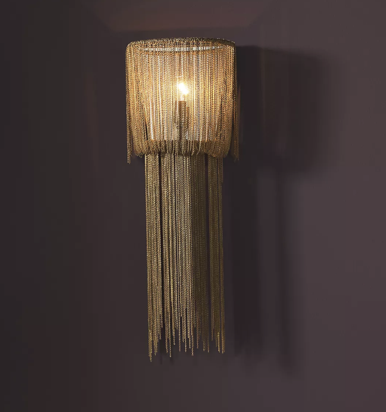 Draped chain wall sconce for a glamorous living room.