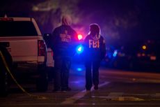  F.B.I. agents monitor the scene near mass shooting.
