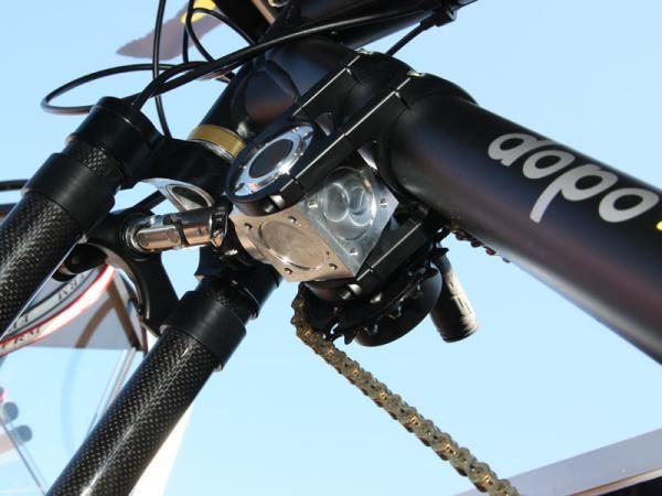 A U-joint transfers the motion into the driver box and allows for normal steering.