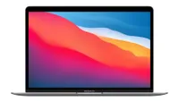 MacBook Air (M1, 2020) with lid open showing colourful background desktop