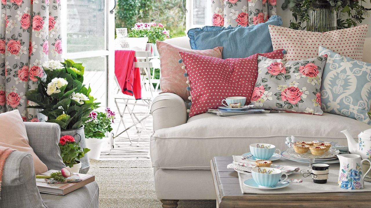 living area with sofa set and cushions