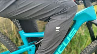Close up of rider's leg on bike wearing Mons Royale Virage pants