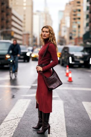 woman wearing red top, red skirt, and boots