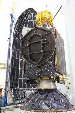 A photograph of the golden Beresheet payload nestled within the SpaceX Falcon 9 fairing in preparation for launch.