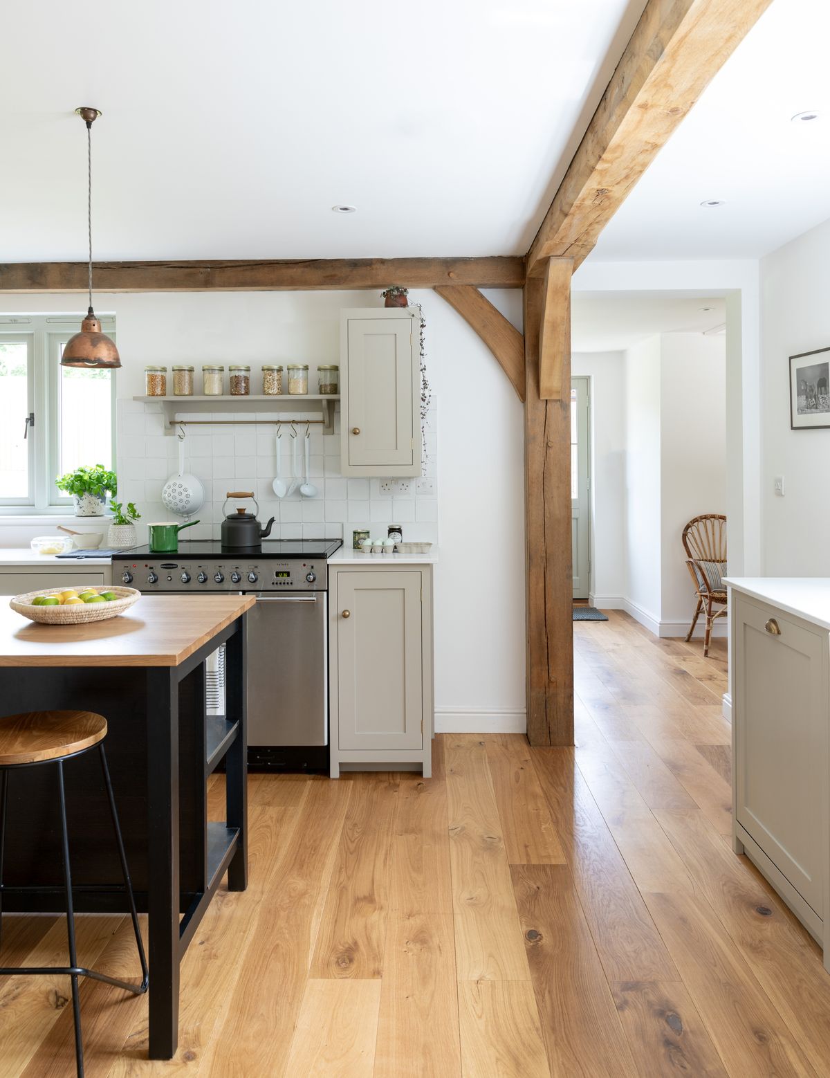 grey kitchen with white worktop and island
