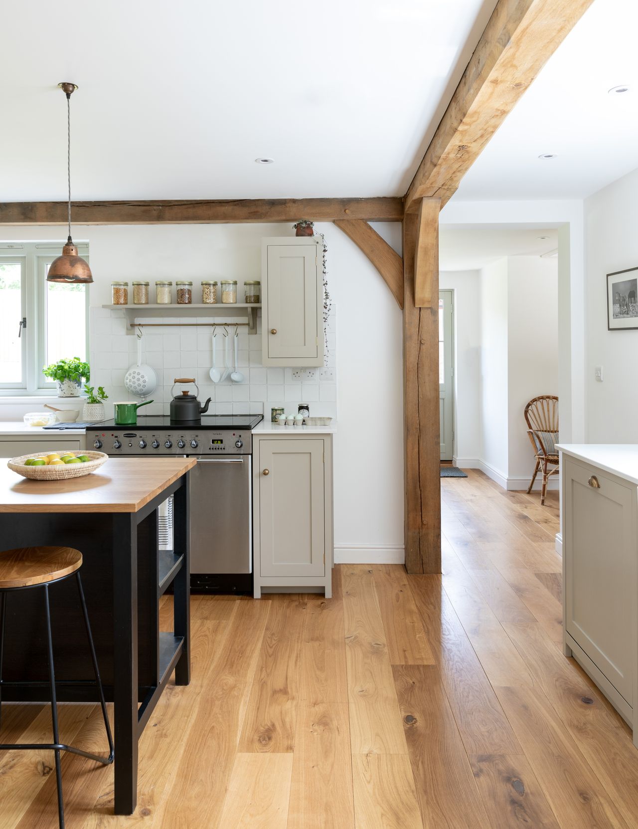 grey kitchen with white worktop and island