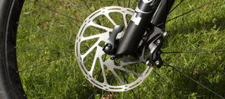 A mountain bike disc brake rotor on a bike wheel
