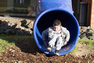 After receiving his new skin, the boy plays on the grounds of the hospital in Bochum, Germany.