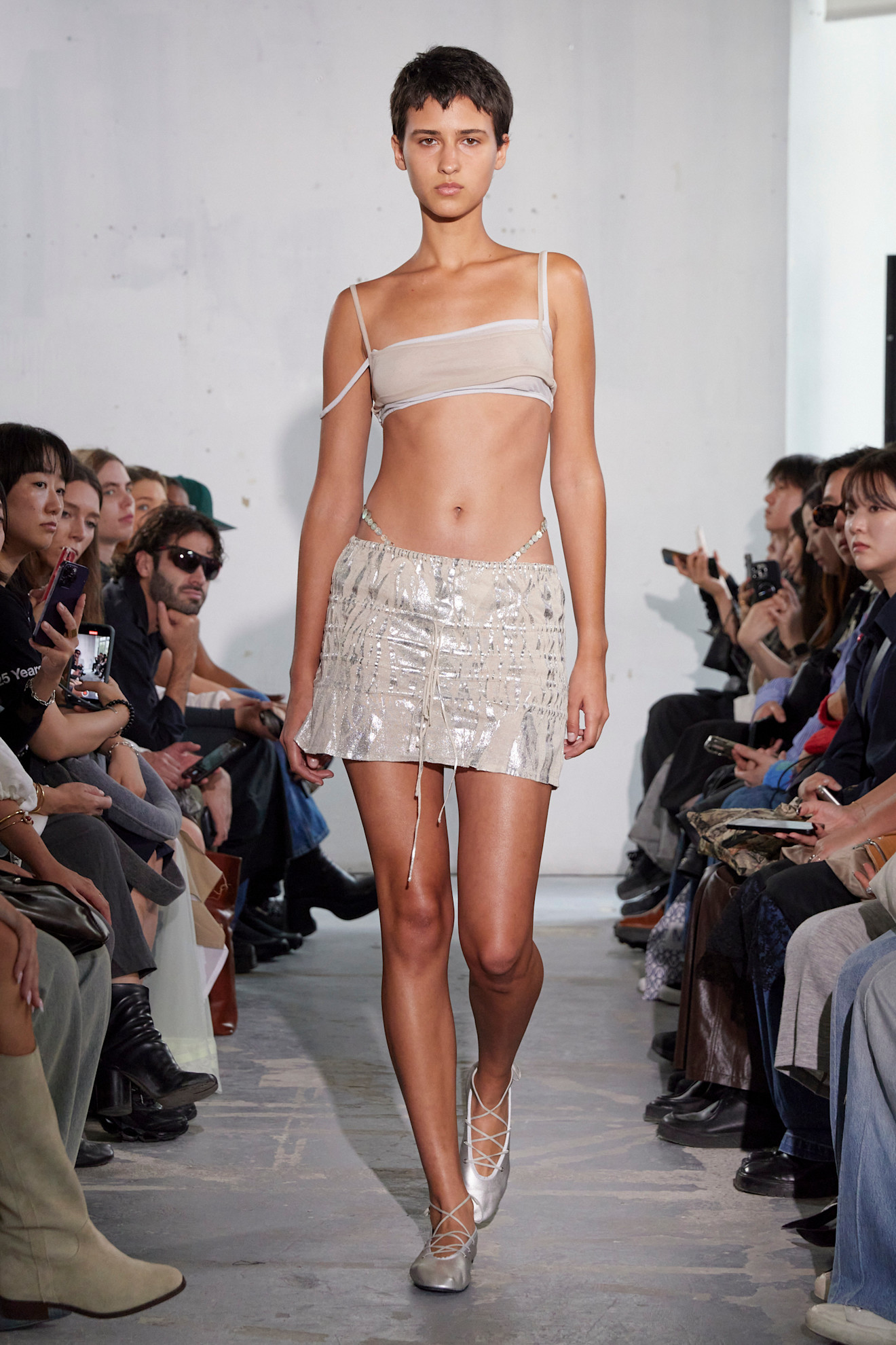 An image of silver flats on the Paloma Wool runway.