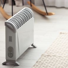 Electric heater standing up in room