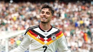 Kai Havertz of Germany celebrates scoring a goal at the World Cup 2026 by stretching his arms out.