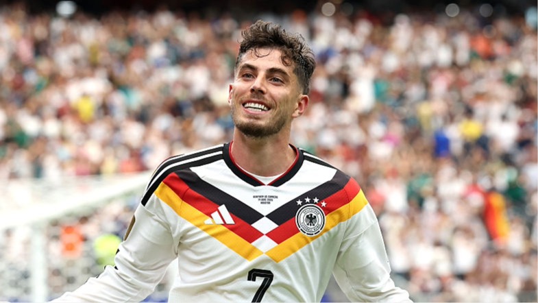 Kai Havertz of Germany celebrates scoring a goal at the World Cup 2026 by stretching his arms out.