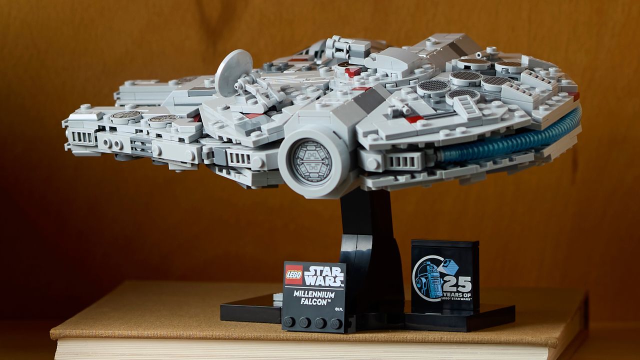 Lego Millennium Falcon seen from the side, on a book shelf