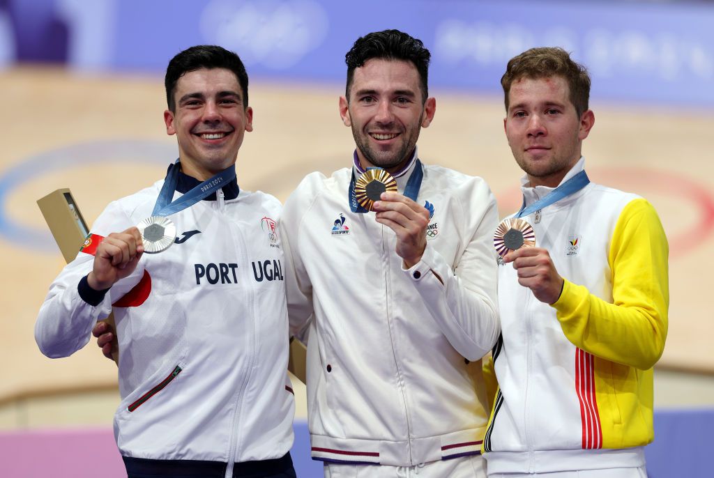 PARIS FRANCE AUGUST 08 Gold medalist Benjamin Thomas of Team France C Silver medalist Iuri Leitao of Team Portugal L and Bronze medalist Fabio van den Bossche of Team Belgium R pose on the podium after the Mens Omnium Points Race 44 on day thirteen of the Olympic Games Paris 2024 at SaintQuentinenYvelines Velodrome on August 08 2024 in Paris France Photo by Alex BroadwayGetty Images