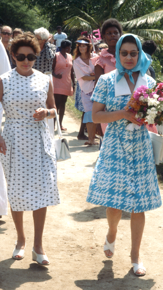 Princess Margaret shows her sister, Queen Elizabeth ll around the island during the Queen and Prince Philip's visit to Mustique in 1977 in Mustique