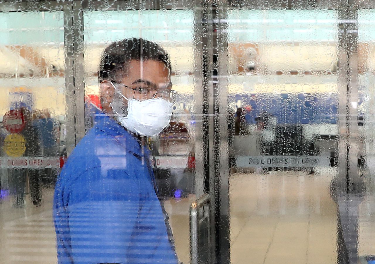 A worker wearing a mask