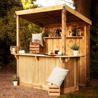 wooden garden bar counter with potted plants