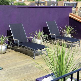 roofs terrace with wooden flooring and aubergine paint