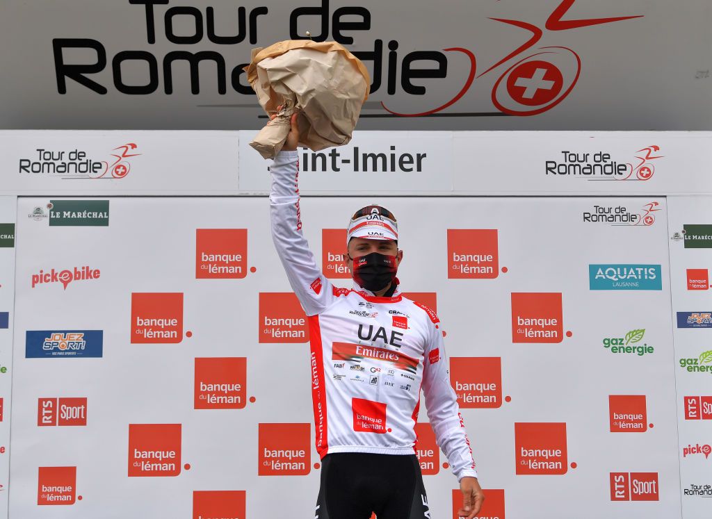 SAINTIMIER SWITZERLAND APRIL 29 Marc Hirschi of Switzerland and UAE Team Emirates White Best Young Jersey celebrates at podium during the 74th Tour De Romandie 2021 Stage 2 a 1657km stage from La Neuveville to SaintImier Flowers Mask Covid Safety Measures TDR2021 TDRnonstop UCIworldtour on April 29 2021 in SaintImier Switzerland Photo by Luc ClaessenGetty Images