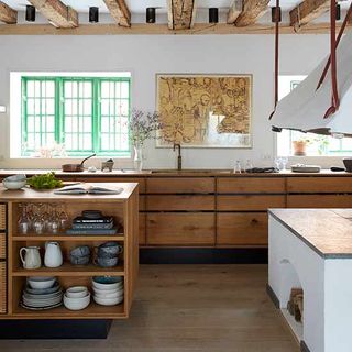 kitchen with ceiling beams or floorboards wood and freshened up the walls with crisp white coat