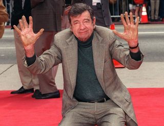Actor WALTER MATTHAU at the Mann's Chinese Theatre, Hollywood, where he became the 213th person to leave his hand & footprints in cement. His new movie, "The Odd Couple II," opens next week.
